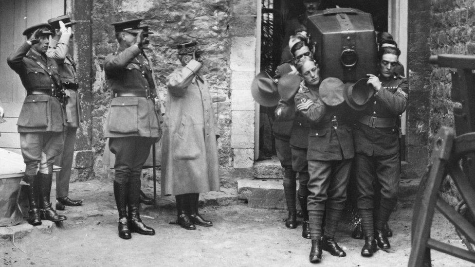 Coffin of Unknown Soldier being carried as it makes its journey to Westminster Abbey in 1920