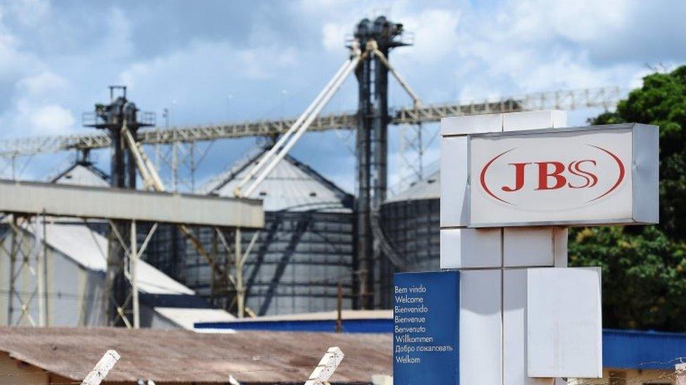 This file photo taken on March 17, 2017 shows a view of the JBS-Friboi Logo at the chicken processing plant entrance, in Samambaia, Federal District, Brazil.