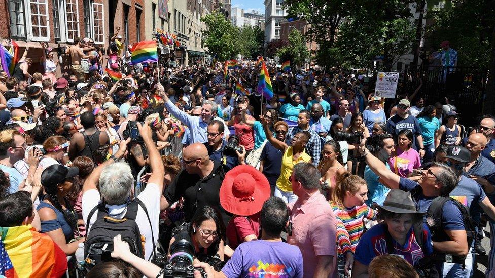 Bill DeBlasio surrounded by marchers