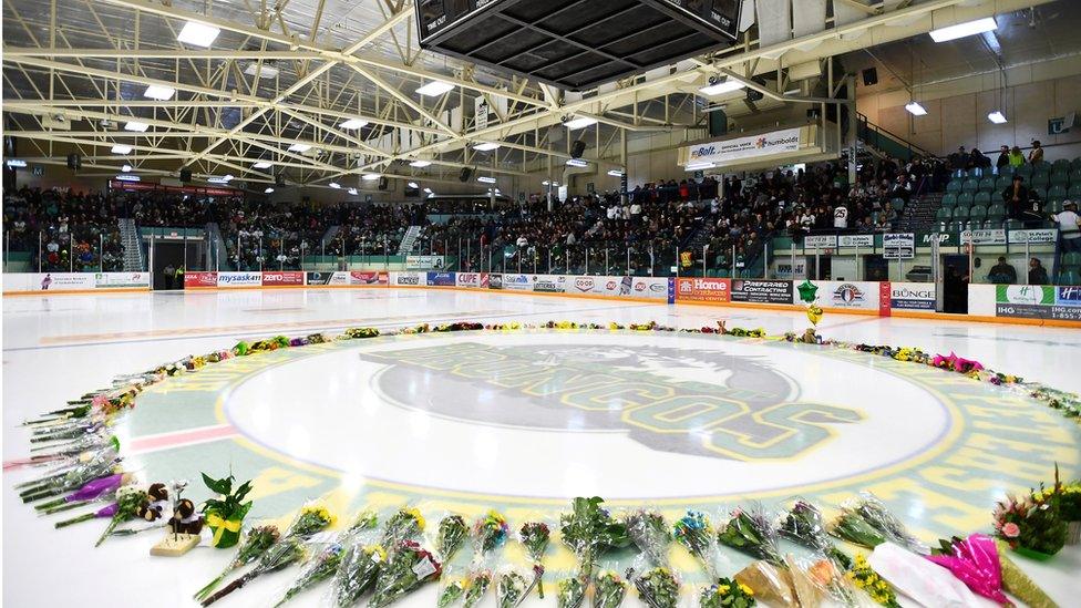 Flowers lie on the ice as people gather for a vigil at the Elgar Petersen Arena, home of the Humboldt Broncos