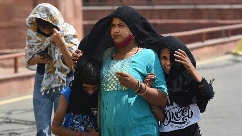 Visitors at Red Fort on a hot summer day on May 14