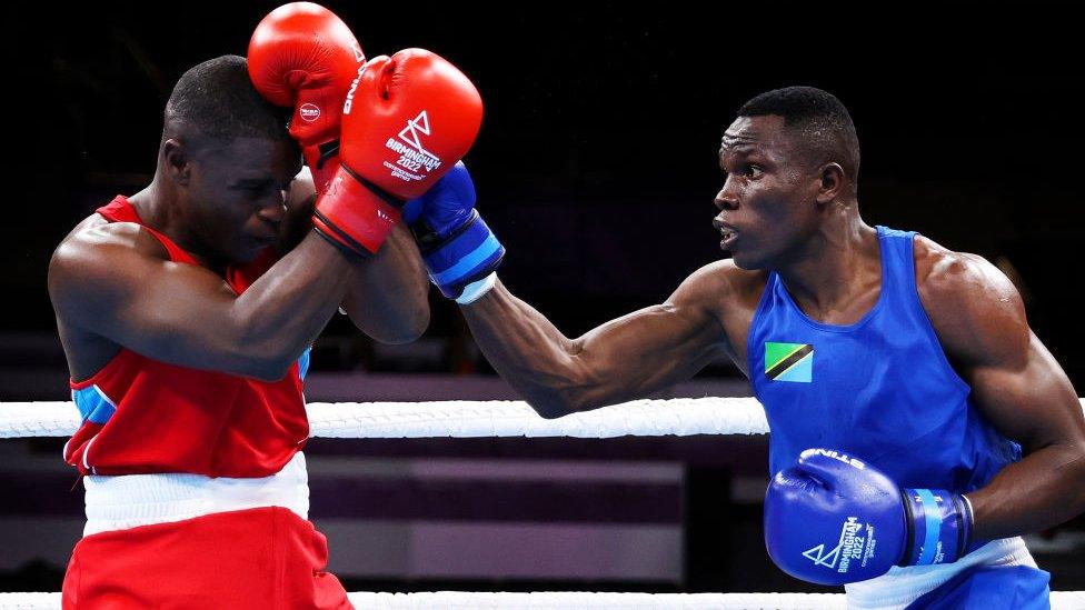 Yusuf Lucasi Changalawe of Team United Republic of Tanzania punches Curlun Richardson of Team Anguilla during the Men’s Over 75kg-80kg (Light Heavyweight) - Round of 16 fight on day four of the Birmingham 2022 Commonwealth Games at NEC Arena on August 01