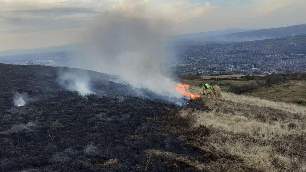 The gorse fire burning on Cavehill on Saturday, taken from a high angle with visible in the background