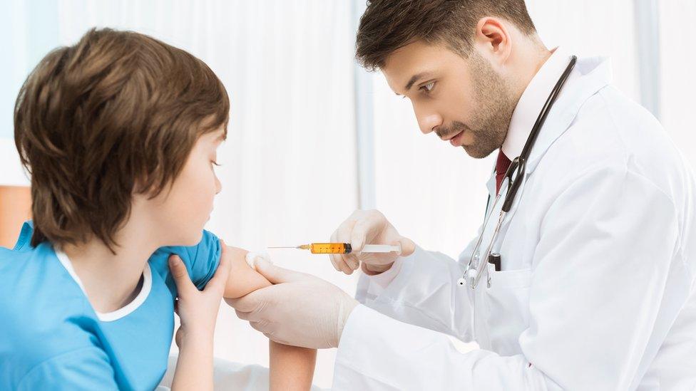 Boy being vaccinated