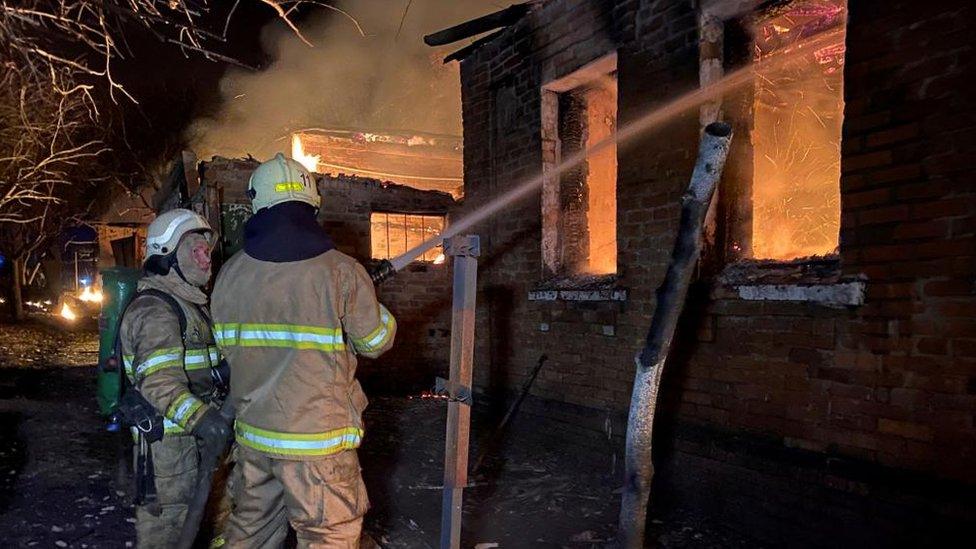 Firefighters spray water on houses in Kharkiv, north-eastern Ukraine. Photo: 10 February 2024