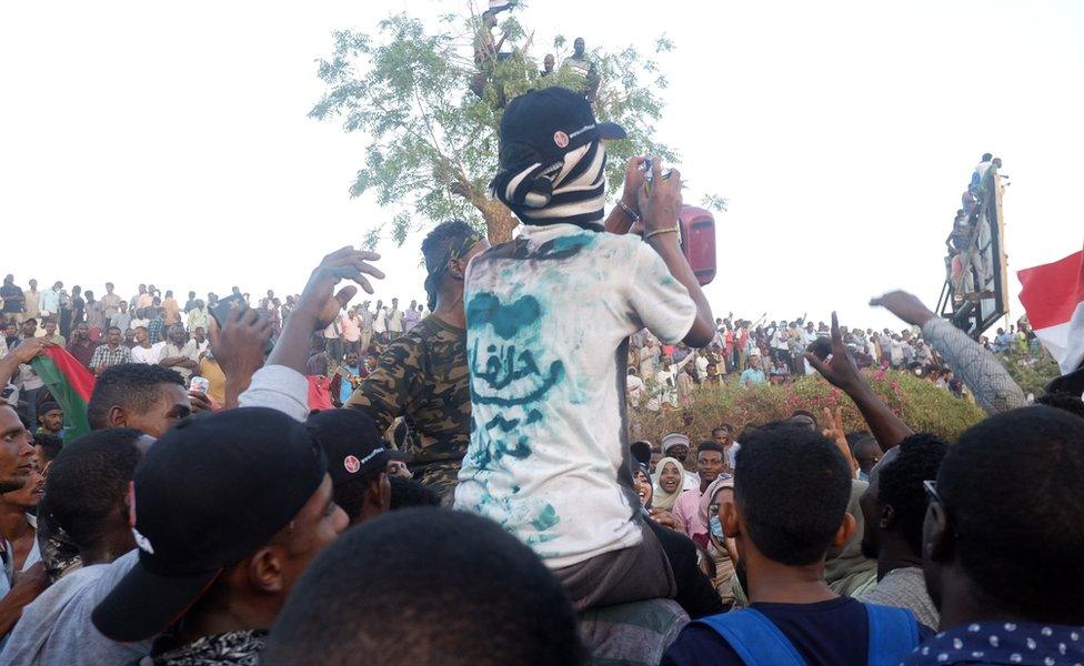 A protester with the words "Halfa" on his T-shirt at a sit-in at the military HQ in Khartoum, Sudan - Monday 8 April 2019