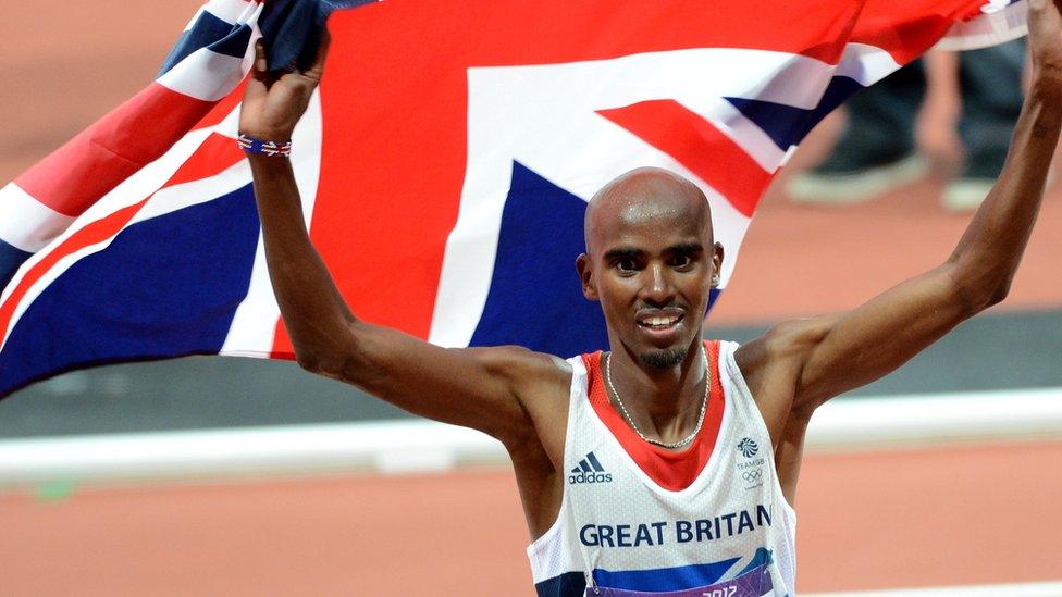 Sir Mo Farah waving a Union Flag for Team GB