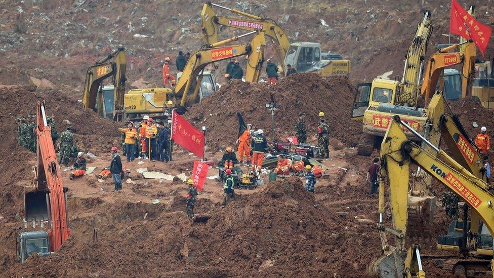 Rescue workers look for survivors after a landslide hit an industrial park in Shenzhen, south China"s Guangdong province on 22 December 2015