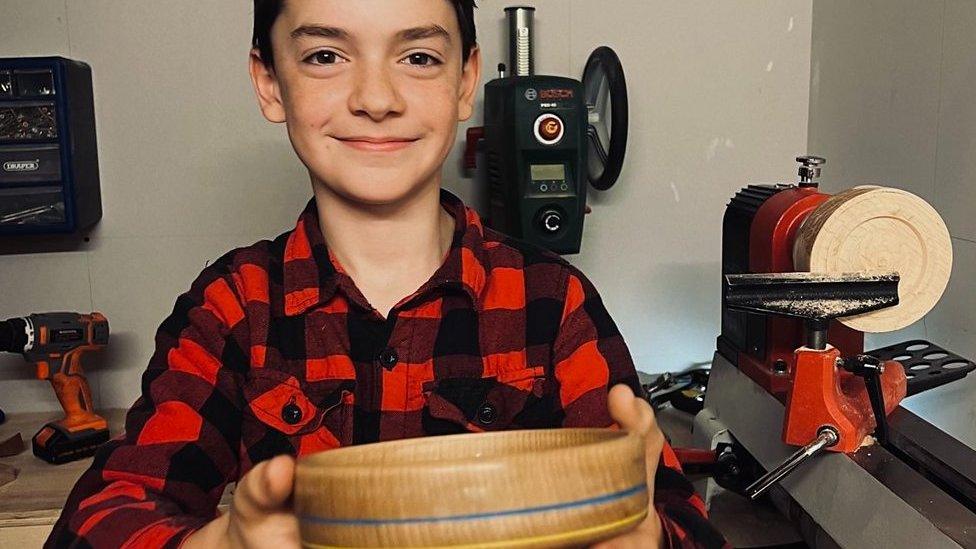 Gabriel holding his bowl