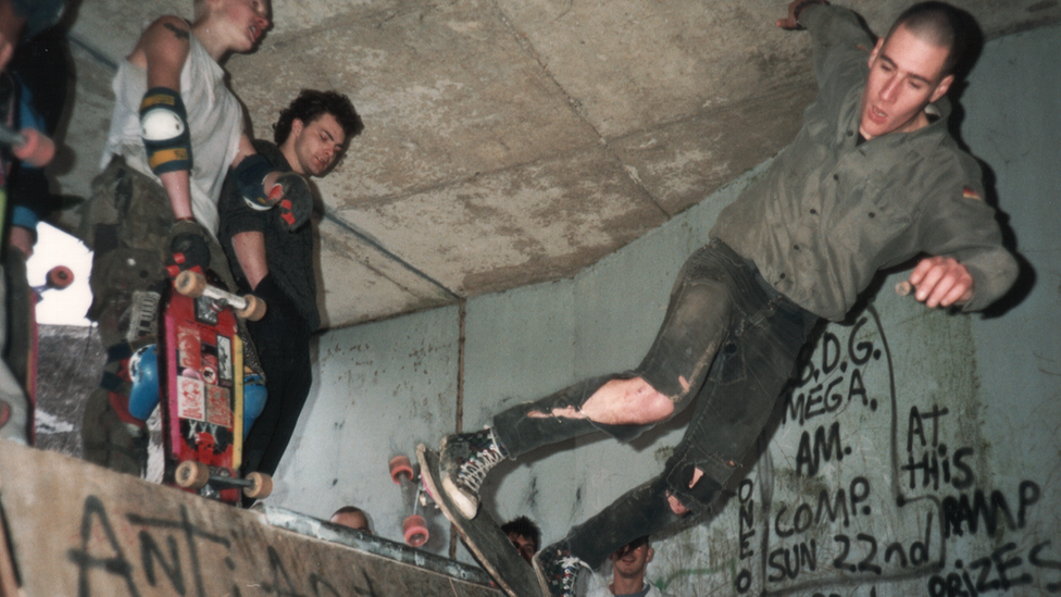 Skateboarders on ramp