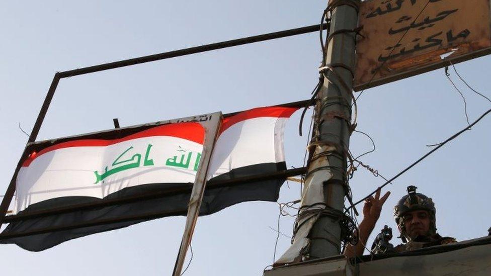 A member of Iraqi counterterrorism forces gestures in Falluja, Iraq, June 26, 2016