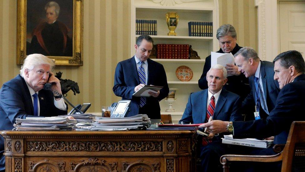 President Donald Trump (L-R), joined by Chief of Staff Reince Priebus, Vice-President Mike Pence, senior adviser Steve Bannon, Communications Director Sean Spicer and National Security Adviser Michael Flynn, speaks by phone with Russia's President Vladimir Putin in the Oval Office at the White House