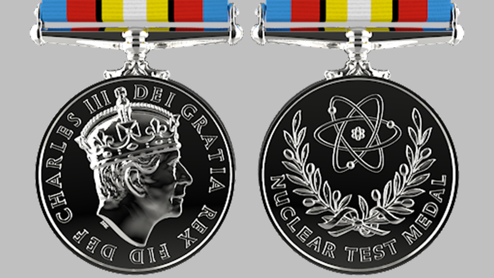 Nuclear Test Medal featuring an atom and olive branches and King Charles' silhouette on the reverse side