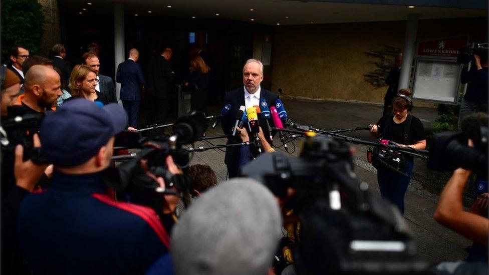 Markus Pfueller, head lawyer for Volkswagen, speaks to the press