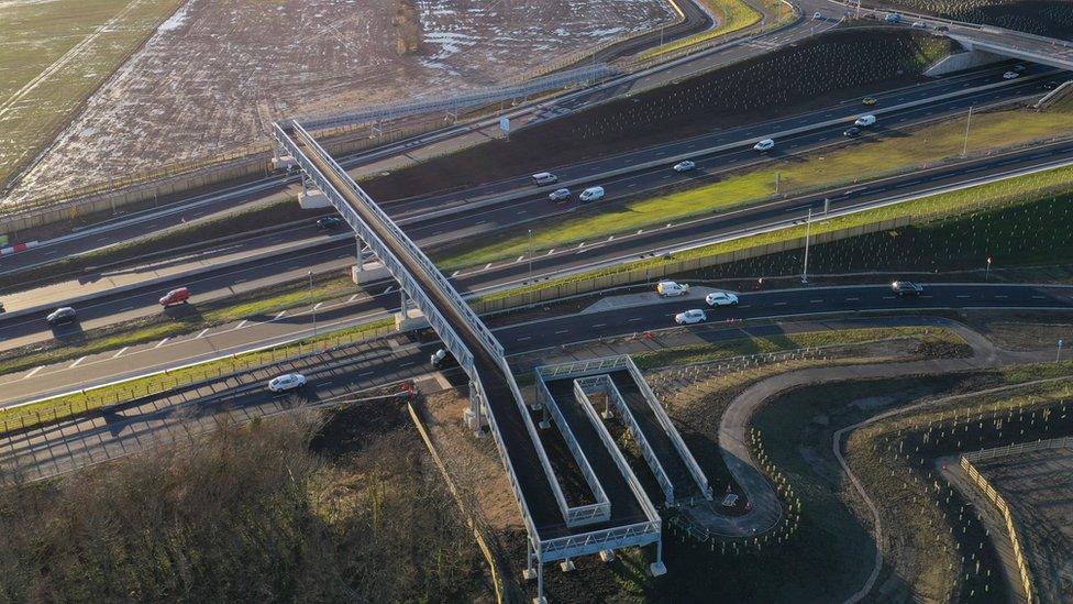 Aerial view of footbridge across the road