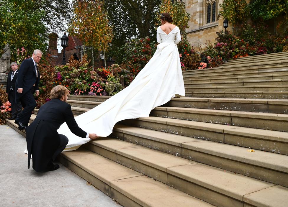 Princess Eugenie arrives accompanied by her father Prince Andrew, Duke of York, at St George"s Chapel for her wedding to Jack Brooksbank in Windsor Castle