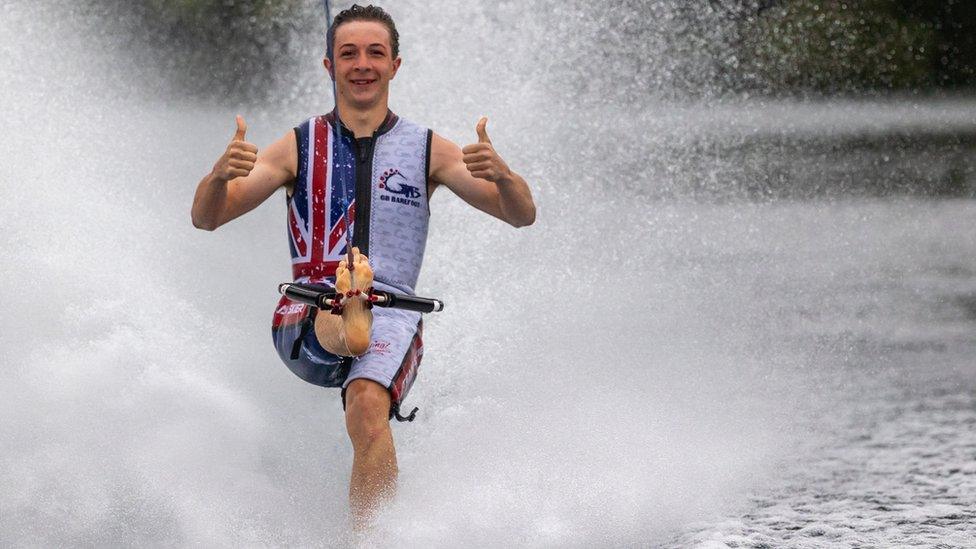 Henry water-skiing on one leg