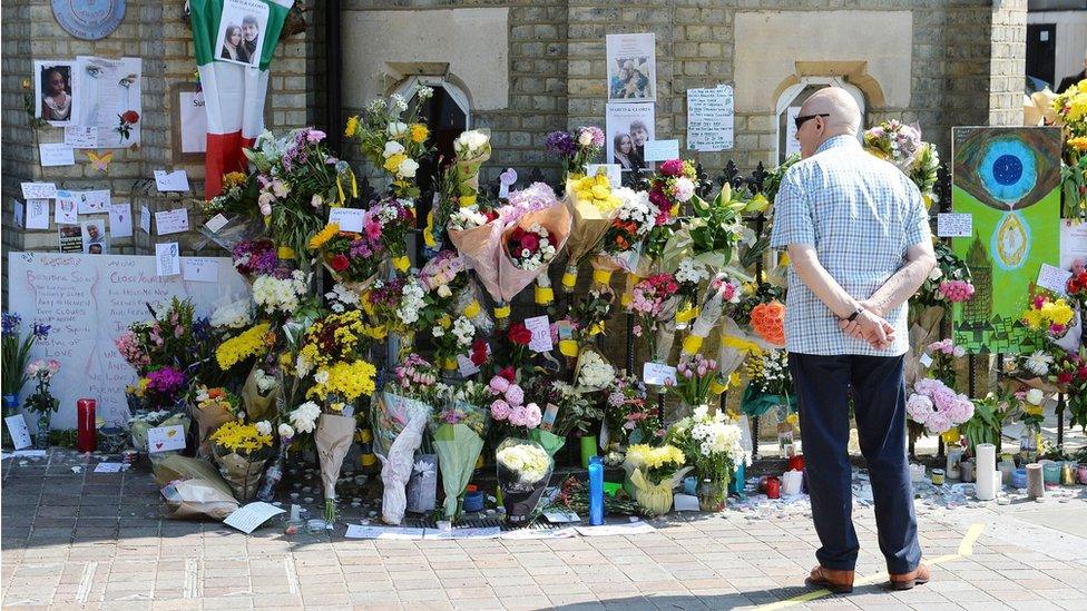 Flowers and other tributes outside the nearby Notting Hill Methodist Church