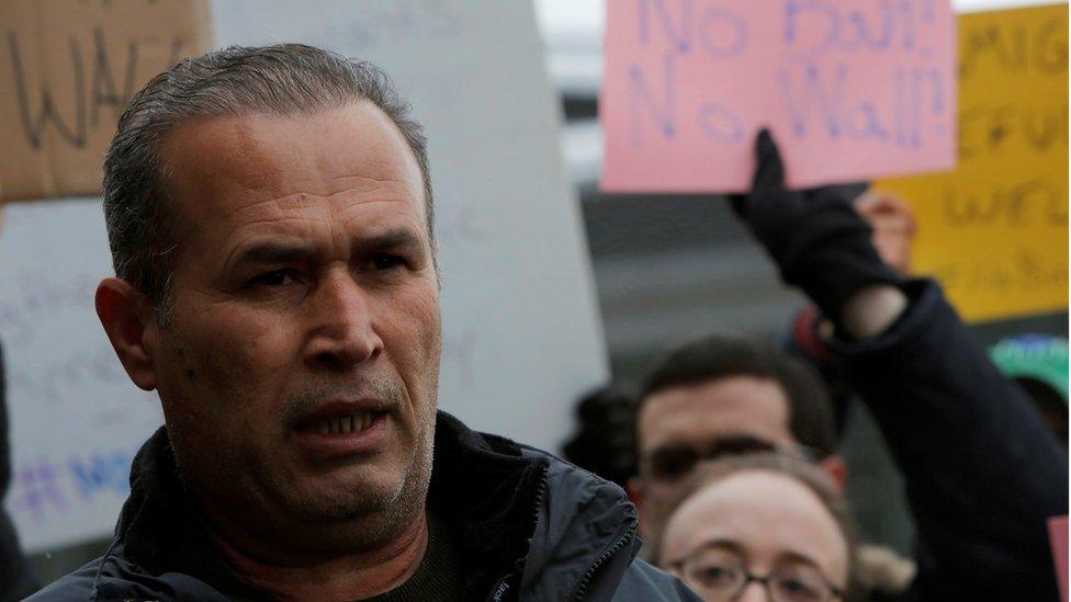 Iraqi immigrant Hameed Darwish addresses the media after being released from Terminal 4 at John F. Kennedy International Airport during the Donald Trump travel ban in Queens, New York (January 28, 2017)