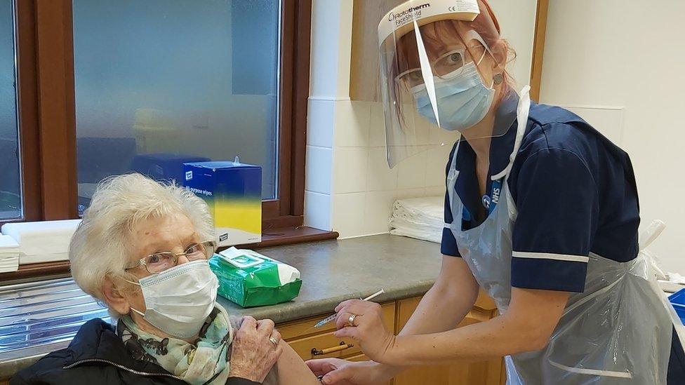 Marcia Sturk receives her vaccine