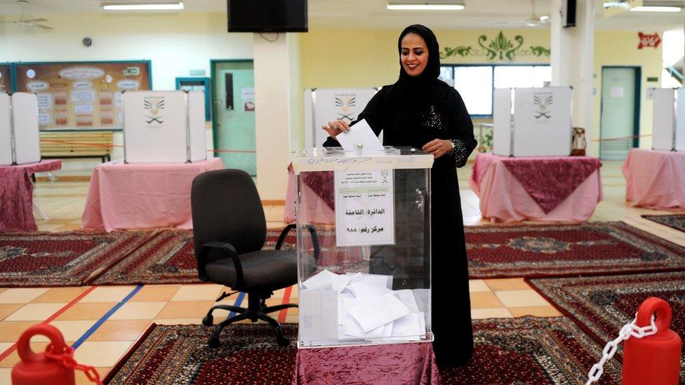 woman at voting booth