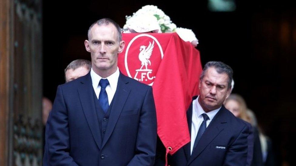 Coffin lead out of funeral