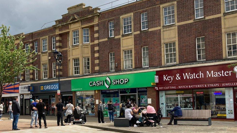 People queuing at the Cash Shop in Rotherham