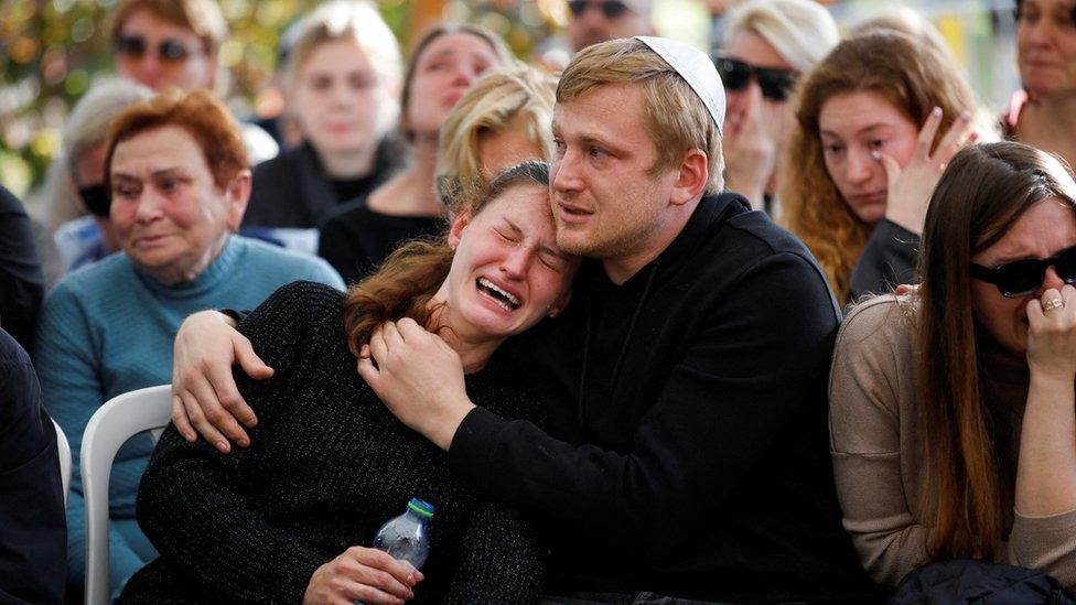 Mourners attend the funeral of Israeli soldier Staff sergeant David Bogdanovskyi, who was killed in the Gaza Strip during the Israeli army's ongoing ground operation amid the conflict with Palestinian Islamist group Hamas, at a cemetery in Haifa, Israel, December 24, 2023