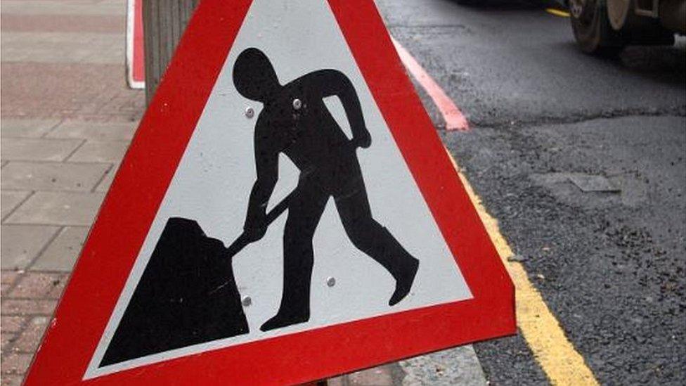 Men at work sign