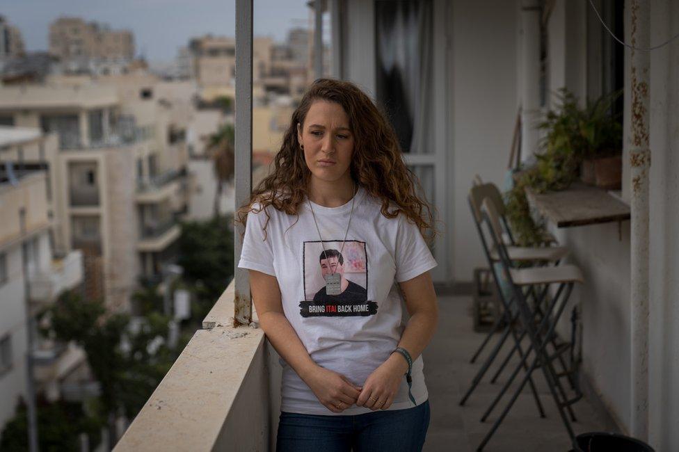 Naama Weinberg, wearing a t-shirt for her cousin Itai. "The healing process is going to be extremely difficult," she said.