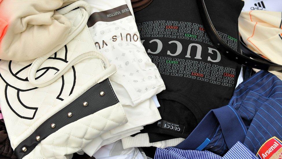 Counterfeit handbags and shirts seized by Customs are displayed at Ministere des Finances on April 22, 2010 in Paris, France