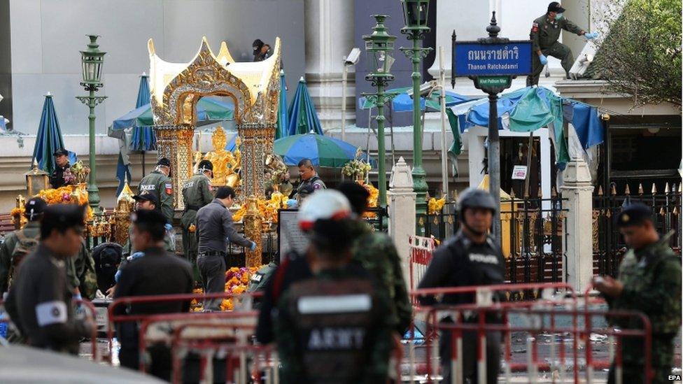 Members of Explosive Ordnance Disposal (EOD) and Thai forensic police officers inspect the scene of the bomb blast at the Erawan Shrine, in central of Bangkok, Thailand, 18 August 2015