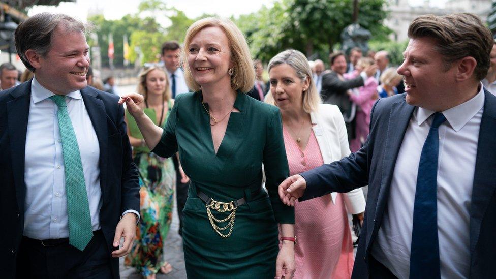 Foreign Secretary Liz Truss celebrates after making it to the final two of the Tory leadership race