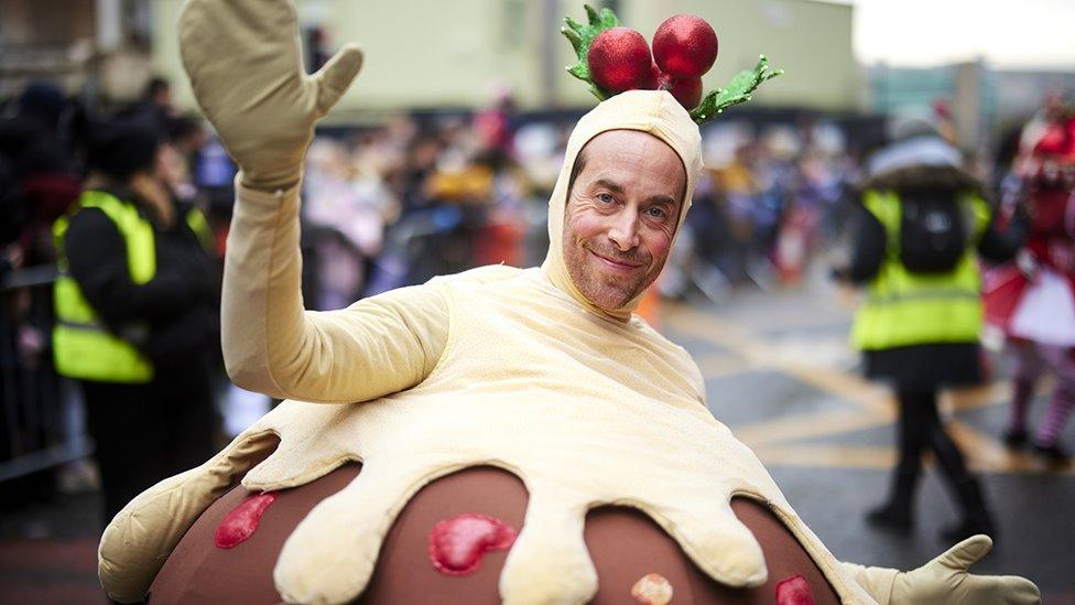 Man dressed as a Christmas pudding