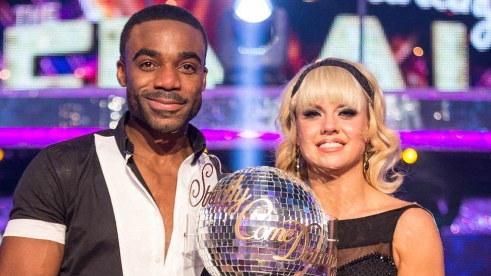 Ore Oduba holds Newsround trophy after winning the competition last year.