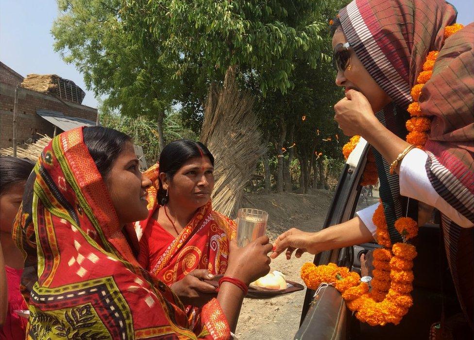 Women offer sweets to Mahua Moitra