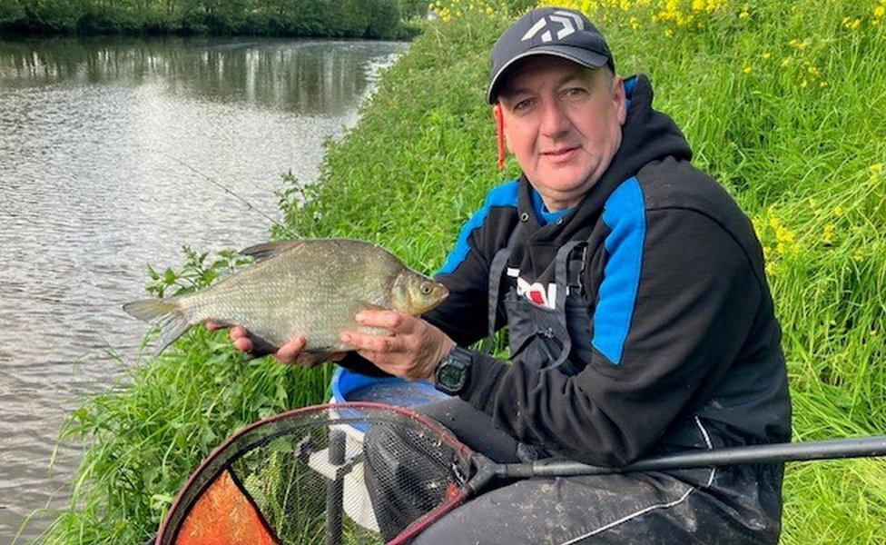 Phillip Jackson holding fish