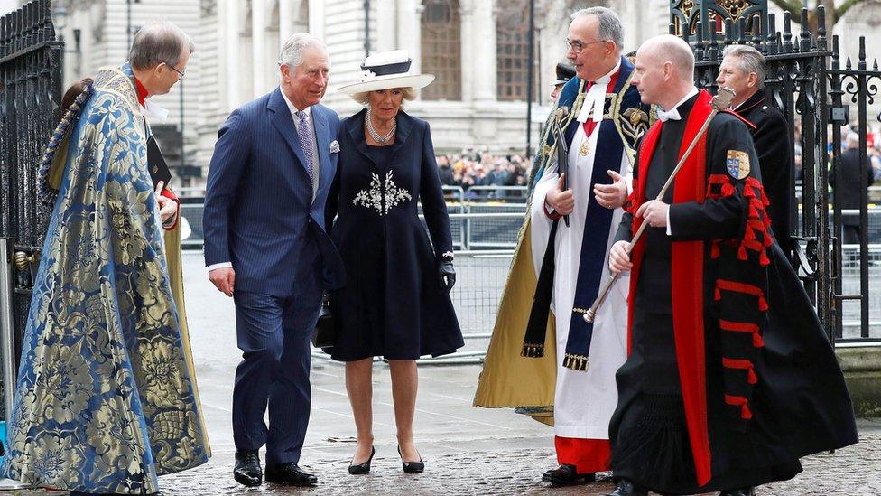 Prince Charles and the Duchess of Cornwall are greeted as they enter the abbey