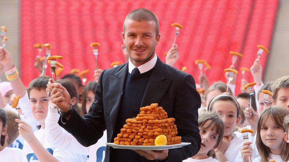 Beckham with a plate of fish fingers