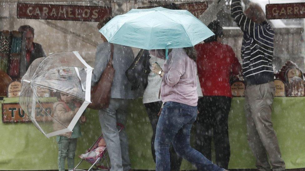 Heavy rainfall in a market in Pamplona in Spain