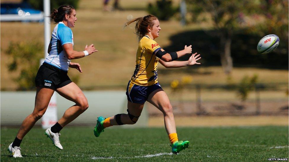 women playing rugby