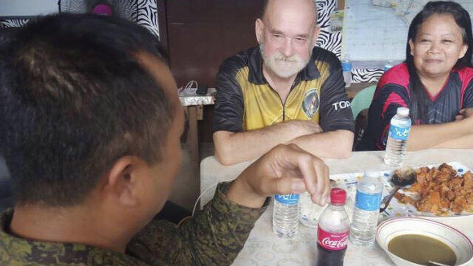 Chief Lieutenant General Cirilito Sobejana with Allan and Wilma Hyrons at a military base in Sulu