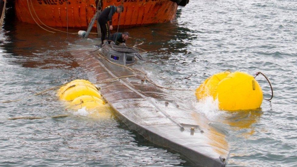 Guardia Civil divers inspect the suspected narco-submarine in Aldán, Galicia