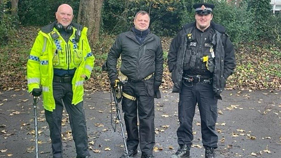 PCSO Alan Mitchell (left) with a volunteer metal detectorist and an officer