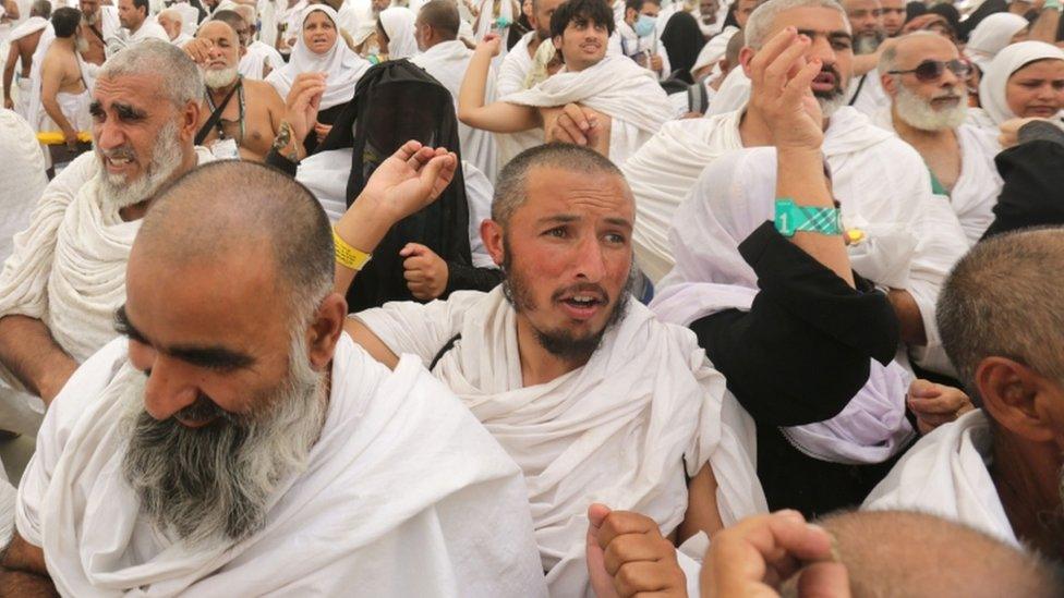 Pilgrims throw stones at pillars at the place where Satan is believed to have tempted Abraham, 24 Sept