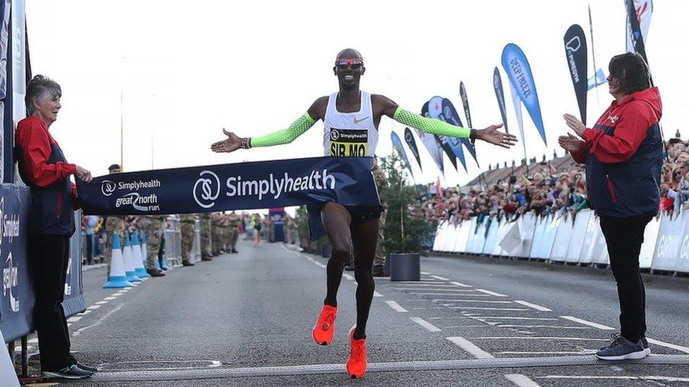 Sir Mo Farah crosses the finish line in the men's elite race