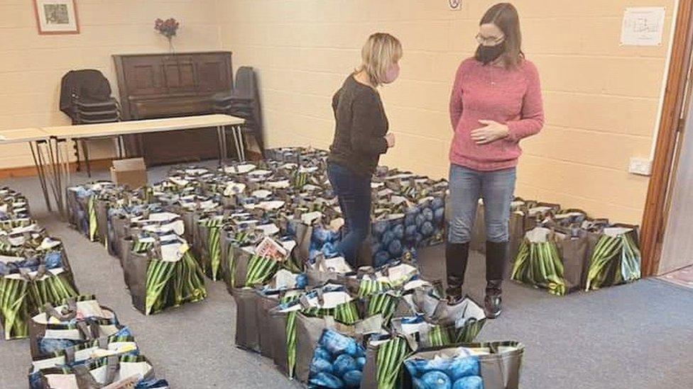 Volunteers helping to pack the food hampers