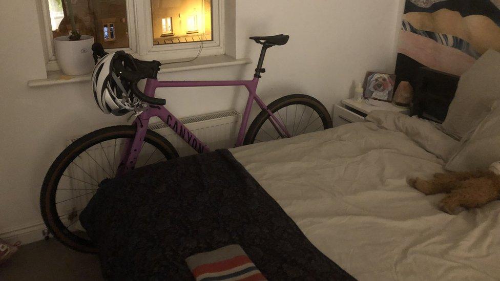 Bike leaning against a bed