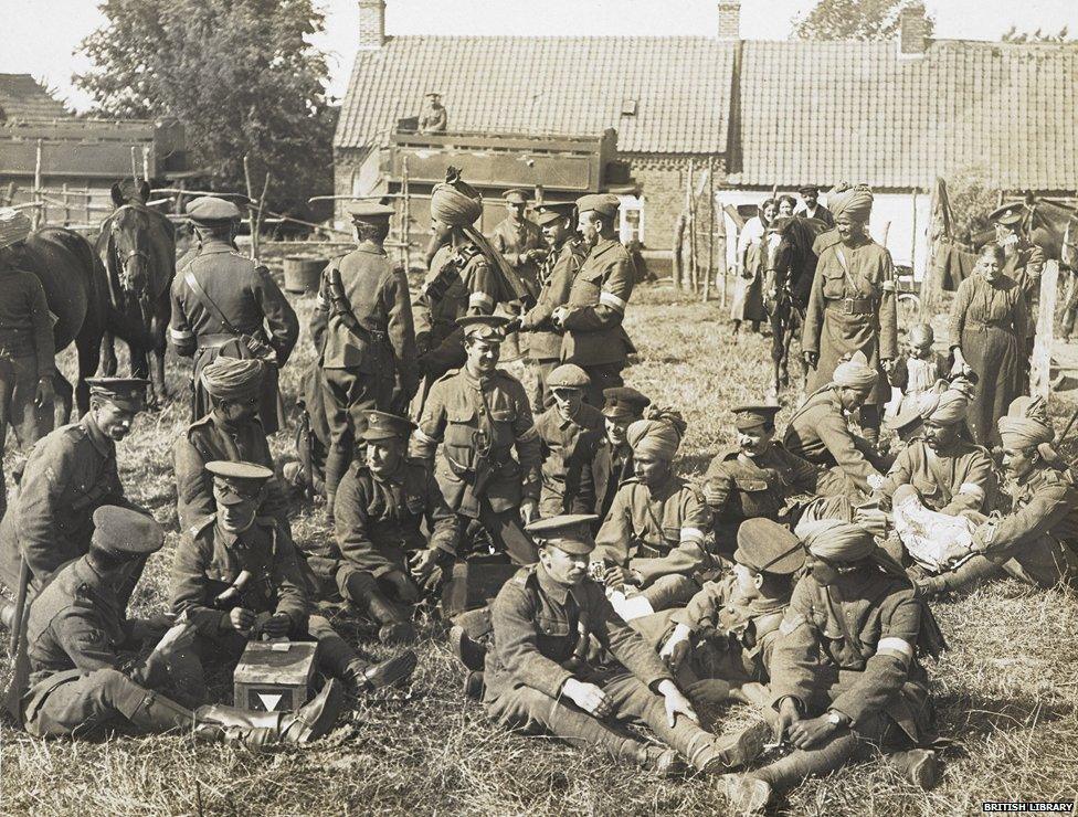 English and Indian soldiers of the Signal Troop of the Lucknow Cavalry Brigade relaxing in a farmyard at Brigade Headquarters, 28 July 1915,