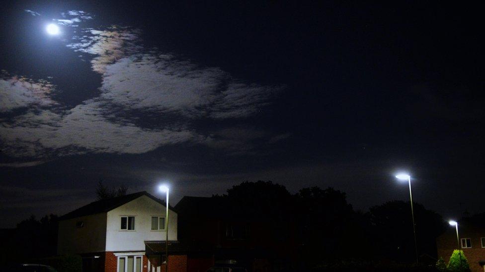 Moon over houses